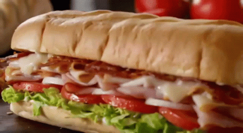 Gif картинка с вкусным бутербродом.